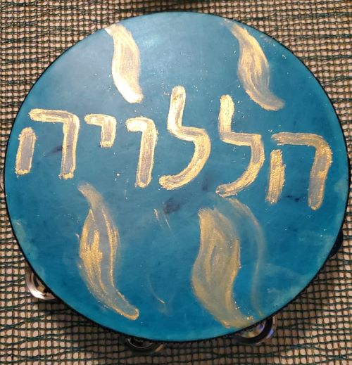 blue tambourine with Hebrew letters